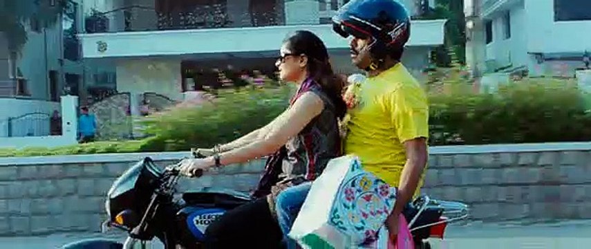 Wife Riding Bike with Husband Sitting Behind