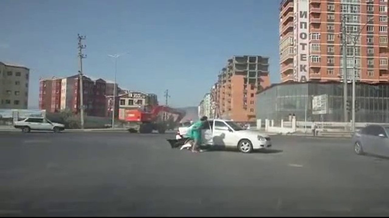 Lady in green dress ejected from car