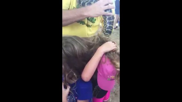 Twins Get Snake Tangled in Hair