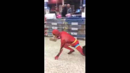 Superheroes in midnight Tesco fight in London, UK