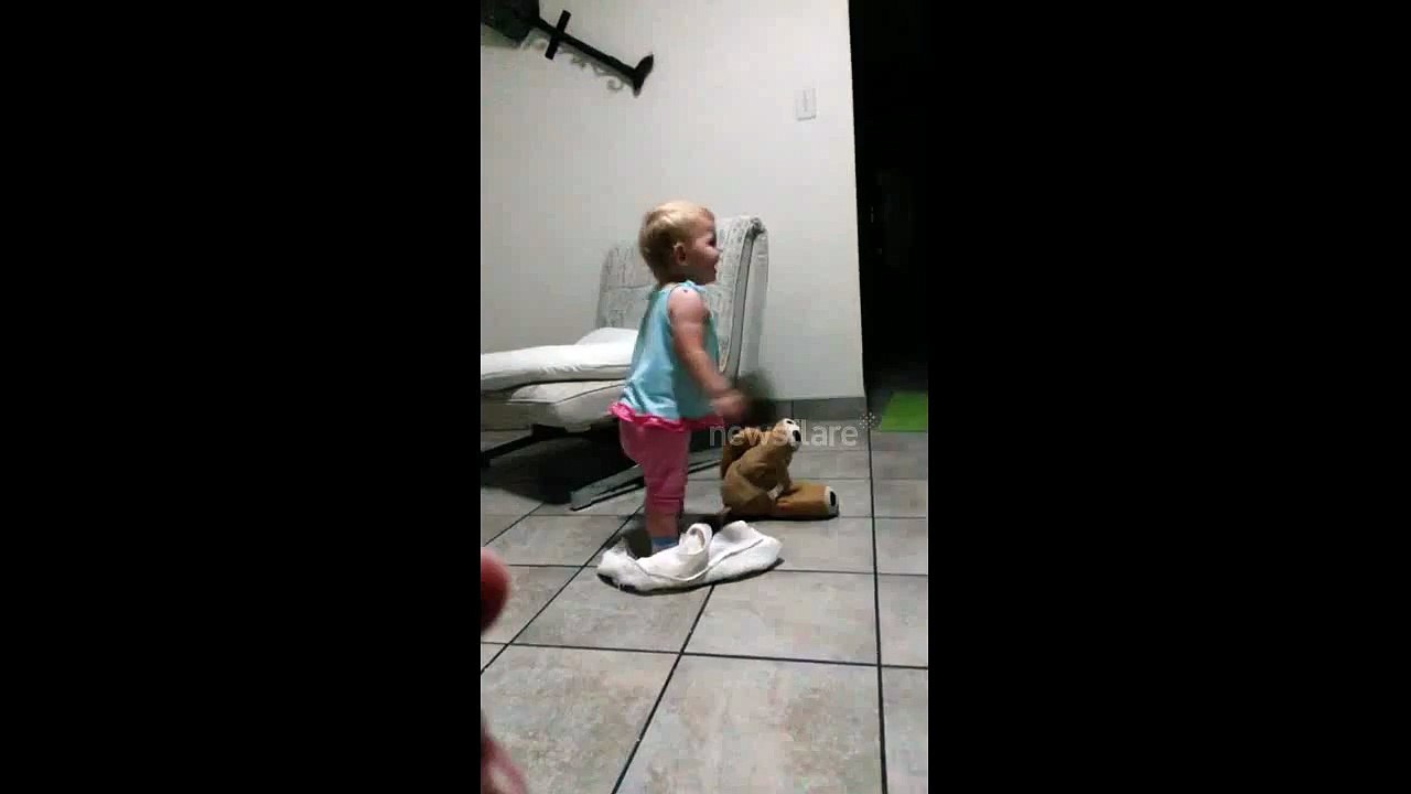 Baby laughs until he falls over