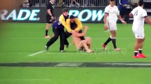 Streaker gets spear tackled during rugby match