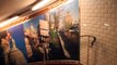 Walking down the stairwell to the platform in Abbesses Metro station in Paris