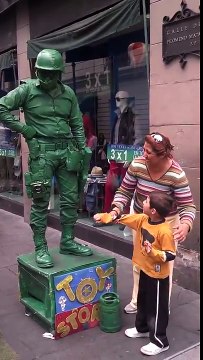 Funny giant Toy Story Soldier Street Performer plays with a Kid!