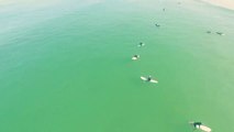 Drone footage picks up a 10ft Shark swimming nearby unknowing surfers