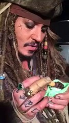 Johnny Depp as Captain Jack Sparrow feeding a Baby Bat