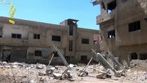 LiveLeak - Syrian Sunni Arab citizen soldiers hit the Dara'a City court building with a rocket-copypasteads.com