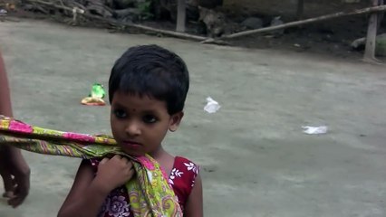 Little girl chases another girl for her Goat in Bangladesh Village