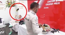 Lewis Hamilton throw a cap to Nico Rosberg but he throws back to hamilton's face