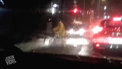 Bicyclist Struggles In Flood  Cyclist vs. Storm