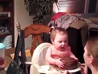 Baby Enjoying His First Birthday Cake