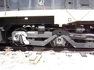 Train locomotive is re-railed after derailing.