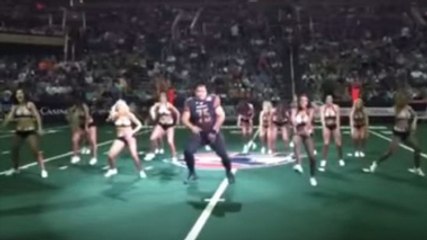 Burly Football Player Crashes Cheerleaders' Routine And Steals The Show