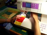 Sewing a log cabin quilt square