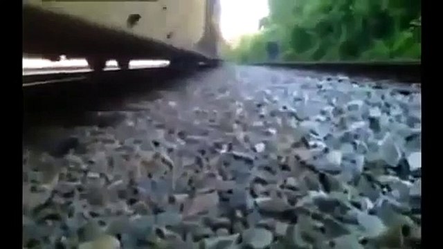 Crazy Kid Under Moving Train Escapes Between Wheels