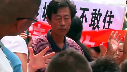 Tianjin residents seeking answers over blast stage emotional protest