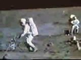 Moon Landing Hoax Apollo 16 : Astronaut Blows on a Rock Through a Hole in His Helmet For Breathing