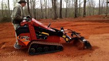 Ditch Witch SK850 Mini Skid Steer with Harley Rake Attachment