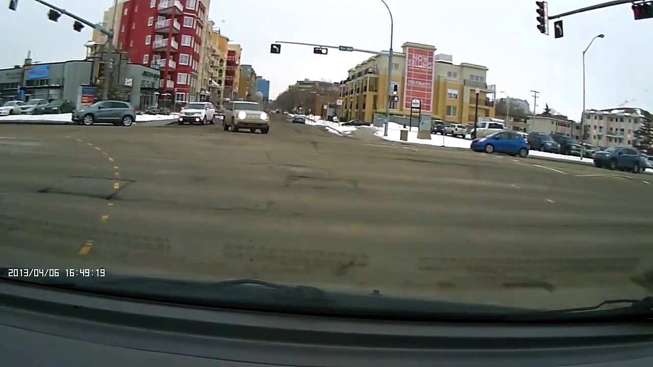 Edmonton streets and potholes - April 6 - a little new snow and old potholes