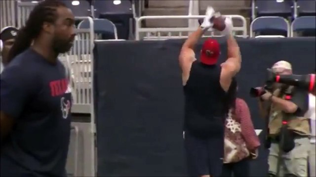 Football player throws ball to fan standing in the stadium upper deck! JJ Watt 2015