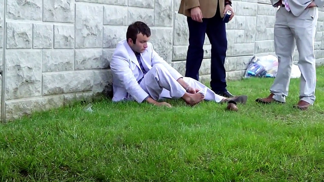 "Drunk" college kid attempts to put his sock on