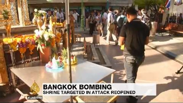 Erawan shrine reopens in Bangkok as police hunt suspect