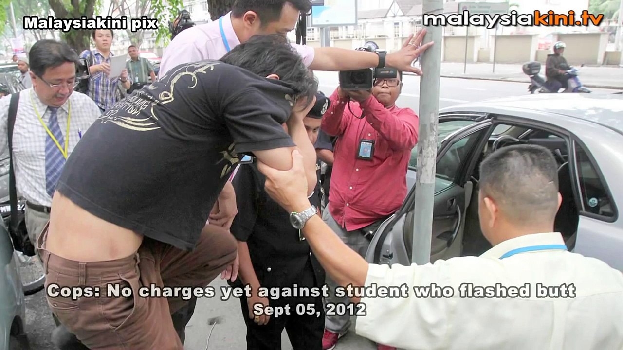 Cops: No charges yet against student who flashed butt