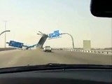 Truck destroys overpass signs on freeway