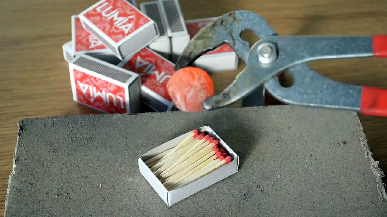 Hot metal ball on box of matches - experiment