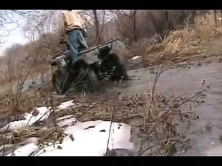 Скачать видео: Honda Rancher 350 4x4 put to the test, mud, ice, water, air..Mudding, offroading! BADASS ATV!!