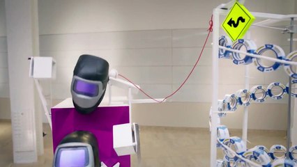 Une machine de Rube Goldberg impressionnante avec des Post-it et du Scotch