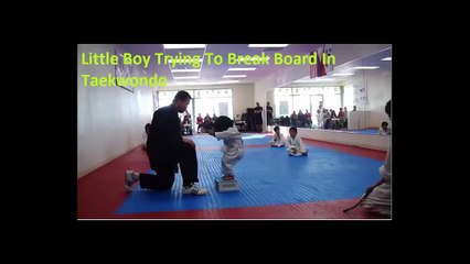 Little Boy Trying To Break Board In Taekwondo