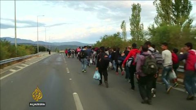 Macedonian police drive back refugees with tear gas and stun grenades