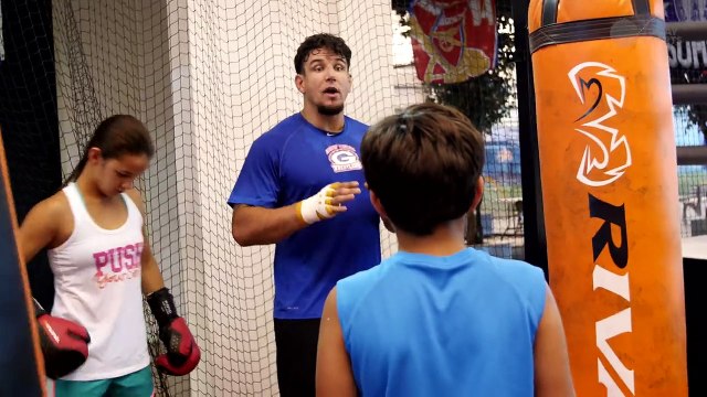 UFC heavyweight Frank Mir takes time out of his workout to share boxing tips with his kids