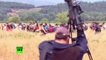 RAW: Thousands of migrants, refugees rush past police across Greece-Macedonia border