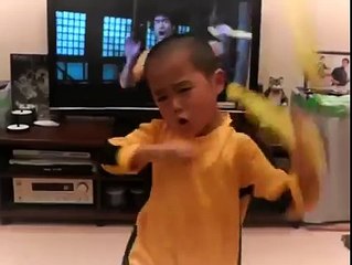 A Little Bruce Lee Sounds ,Moves and Work Those Nijha Chucks Just Like The Original Bruce Lee .Wow,Great Job Watch Out He s Dangerous