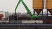 SENNEBOGEN - Scrap Handling: 860 Mobile with orange peel grab loading ship, Germany