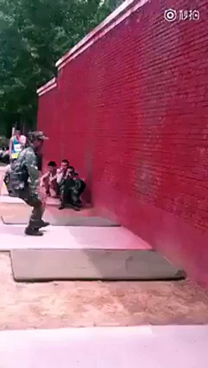 3 guys all scale this wall with wolf-like coordination