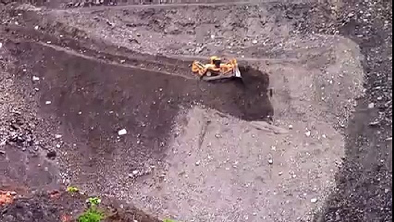 SIDE SLOPING – This driver has the most dangerous job in the world!