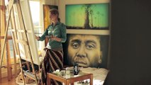 Sofia Minson painting an oil portrait of an old woman in her art studio