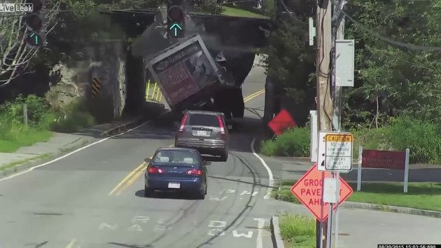 Truck violently slams into railroad bridge in Massachusetts