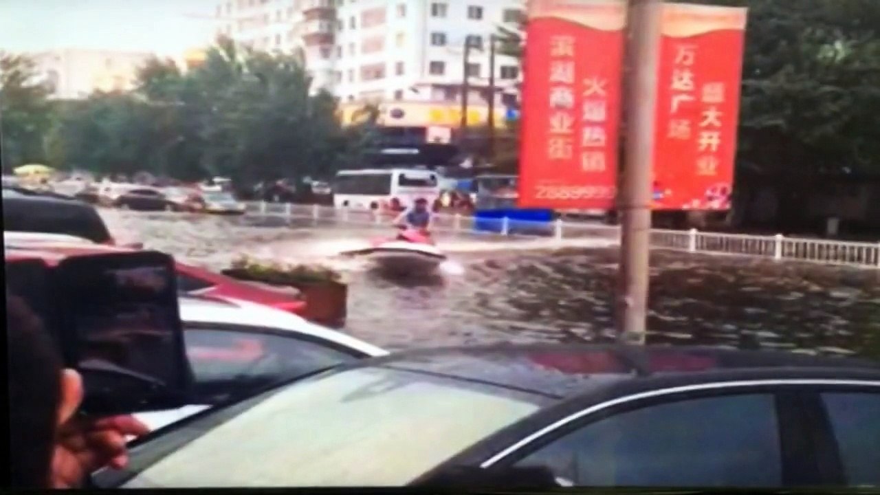 Man drives jet ski in Shanghai flood