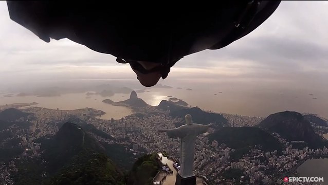Wingsuit Flyling Under Arm of Christ The Redeemer In Rio De...