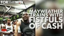 Floyd Mayweather trains with fistfuls of cash