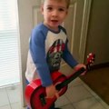 2 year old boy jamming to Metallica.