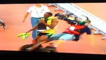 Usain Bolt stumbles over cameraman