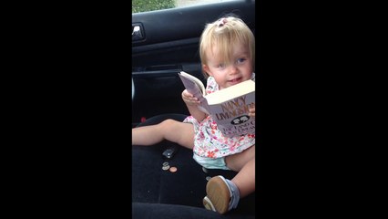 One-year-old reading out loud