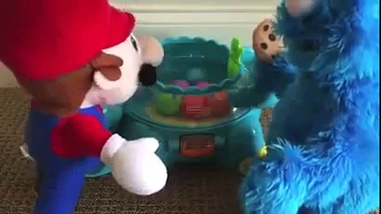 Mario vs Cookie Monster Poppity Pop Musical Dino Ball Popper Dinosaur made by Fisher Price