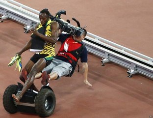 Usain Bolt knocked down by a cameraman in Beijing World Championships 200m final