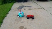 Baby is carried by a RC car in the streets
